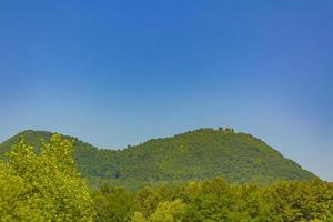 Wonderful mountain and forest landscape with cloudy sky in Slovenia. photo