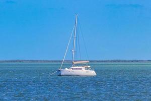 Luxury travel with yacht on Holbox island turquoise water Mexico. photo