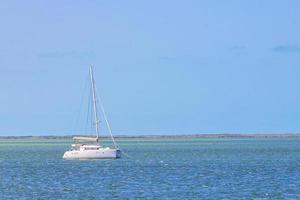 Luxury travel with yacht on Holbox island turquoise water Mexico. photo