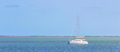 Luxury travel with yacht on Holbox island turquoise water Mexico. photo