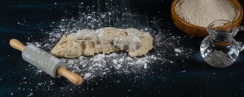 kneading homemade bread with flour, water and salt photo
