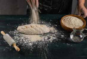 kneading homemade bread with flour, water and salt photo