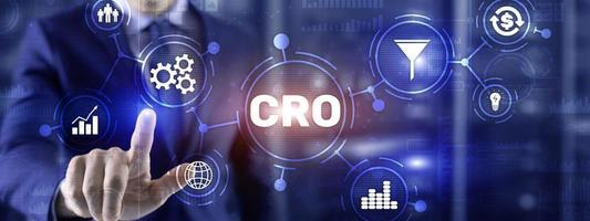 Conversion Rate Optimization. CRO Technology Finance concept Businessman pressing on a virtual screen photo