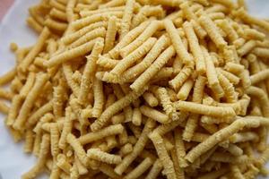 Raw homemade Passatelli. Traditional Italian pasta usually cooked in broth. Close up photo