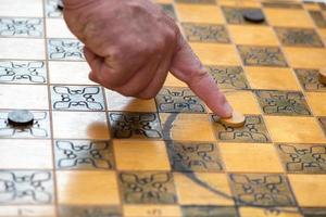 Chessboard with game of checkers photo