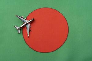 Plane over the flag of Bangladesh, the concept of journey. photo