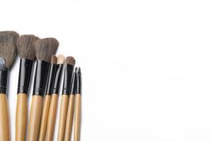 Makeup brushes on white isolated background for female beauty. photo