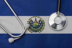 El Salvador flag and stethoscope. The concept of medicine. photo