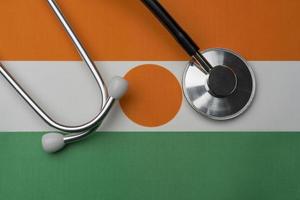 Niger flag and stethoscope. The concept of medicine. photo