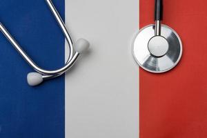 French flag and stethoscope. The concept of medicine.