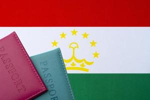 Against the background of the Flag of Tajikistan are passports. photo