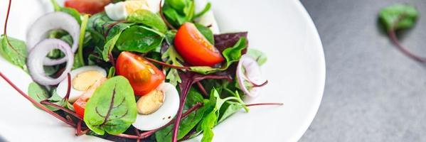 salad quail egg tomato, lettuce mix leaves healthy meal keto or paleo diet