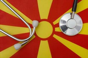 Macedonian flag and stethoscope. The concept of medicine. photo