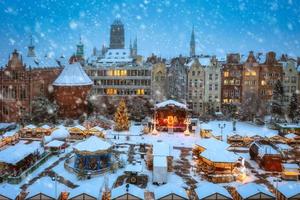 Beautiful Christmas fair in the old town of Gdansk at snowy dawn, Poland