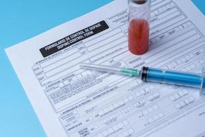 Blank doping control, syringe and blood close-up. photo