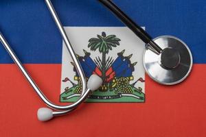 Haiti flag and stethoscope. The concept of medicine. photo