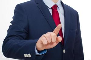 Business man finger touching empty virtual screen isolated on white background. Selective focus and copy space photo