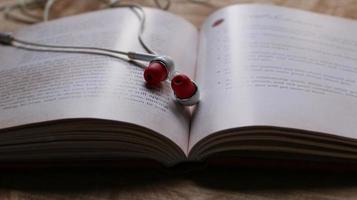 Old Book and a Modern Headset photo