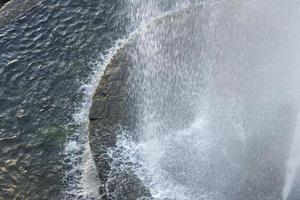 Drops and splashes of the fountain close up. photo