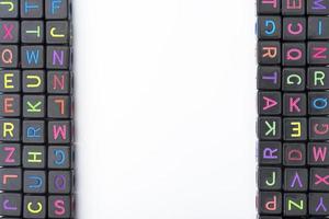 Many colorful decorative cubes with letters on a white background. photo