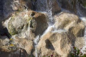 Water flows over the rocks in the Park. photo