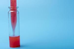 Medical equipment. Blood test.Pipette adding fluid to One of several test tubes. photo