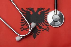 On the flag of Albania is a stethoscope. photo