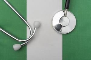 Nigeria flag and stethoscope. The concept of medicine. photo