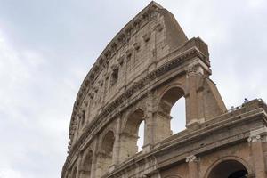 Arches of the Colosseum close-up. Historical attraction photo