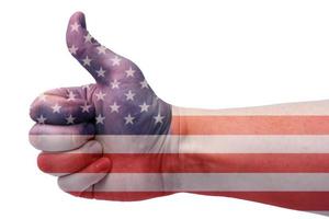 The concept of USA-hand gives a thumbs up with the Us flag. photo