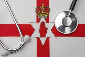 Northern Ireland flag and stethoscope. The concept of medicine. photo