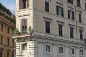 Windows of houses of old houses of Rome in Italy. photo