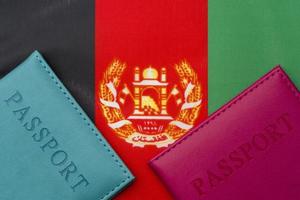 On the flag of Afghanistan is a passport. photo