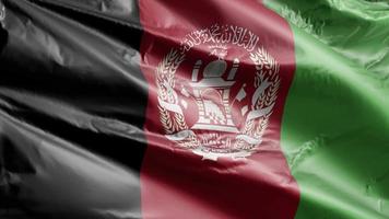 bandiera dell'Afghanistan che ondeggia lentamente sul ciclo del vento. bandiera afghana che ondeggia dolcemente sulla brezza. sfondo di riempimento completo. Ciclo di 20 secondi.
