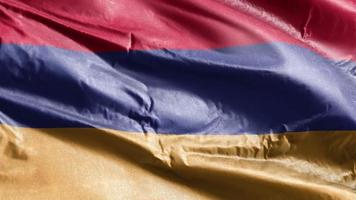 Armenië textiel vlag zwaaien op de wind-lus. Armeense banner zwaaiend op de wind. stof textiel weefsel. volledige vulling achtergrond. 10 seconden lus. video