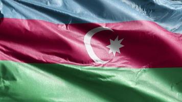 Azerbaijan textile flag slow waving on the wind loop. Azerbaijani banner smoothly swaying on the breeze. Fabric textile tissue. Full filling background. 20 seconds loop. video