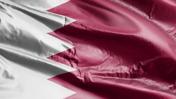 Bahrain flag waving on the wind loop. Bahraini banner swaying on the breeze. Full filling background. 10 seconds loop. video