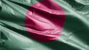 bangladesh textilflagga långsamt viftande på vindslingan. bangladeshisk banner som svajar smidigt på vinden. tyg textilvävnad. full fyllning bakgrund. 20 sekunders loop. video