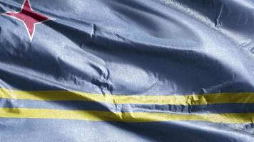 Aruba textile flag waving on the wind loop. Aruba banner swaying on the breeze. Fabric textile tissue. Full filling background. 10 seconds loop. video