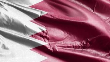 Bahrain textile flag waving on the wind loop. Bahraini banner swaying on the breeze. Fabric textile tissue. Full filling background. 10 seconds loop. video