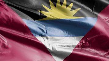 Antigua and Barbada flag waving on the wind loop. Antigua and Barbada banner swaying on the breeze. Full filling background. 10 seconds loop. video