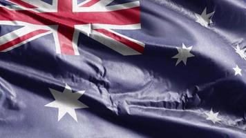 Australië textiel vlag zwaaien op de wind-lus. Australische banner zwaaiend op de wind. stof textiel weefsel. volledige vulling achtergrond. 10 seconden lus. video