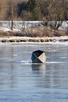 winter in Manitoba - ice fishing on the Red River photo