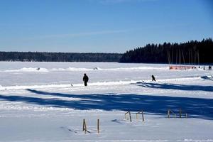 winter in Manitoba - skating on a lake trail photo