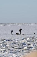 winter in Manitoba - ice fishing on Lake Winnipeg photo