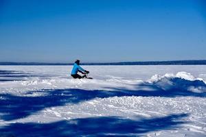 winter in Manitoba - riding a bike in the snow photo