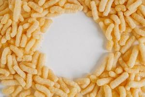 Corn sticks on a white background. Top view. Place for your text photo