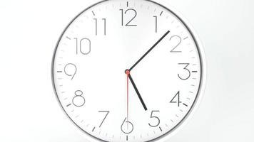 White wall  clock isolated on white background. Time lapse 1 hour. video