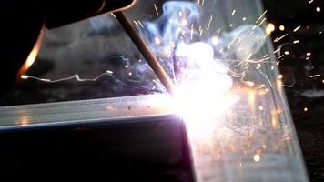 Close-up Welding of steel produces light. Causing sparks that are not good for the eyes. video