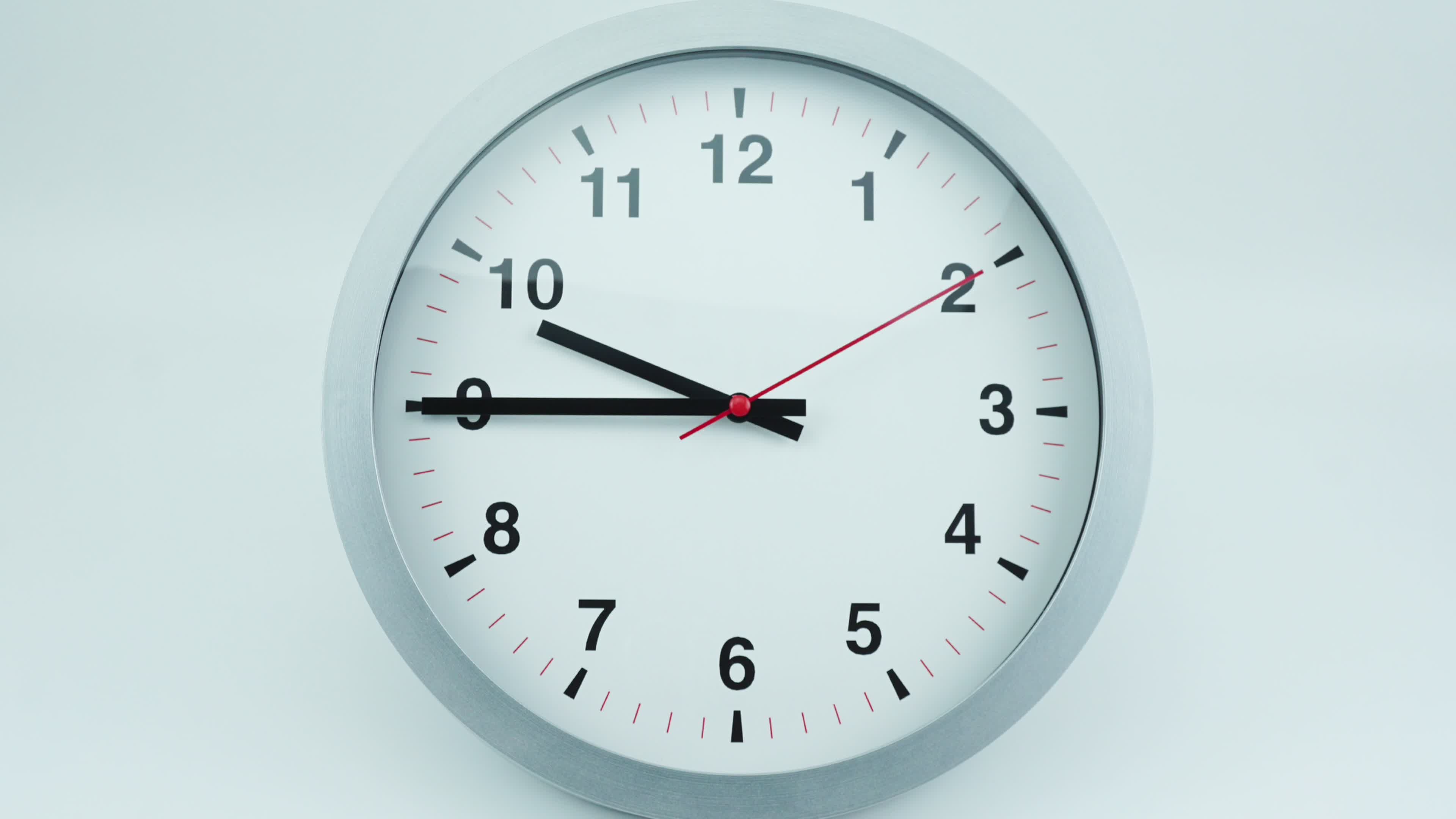 Time lapse, White wall clock tells the time of ten o'clock. Rotation of